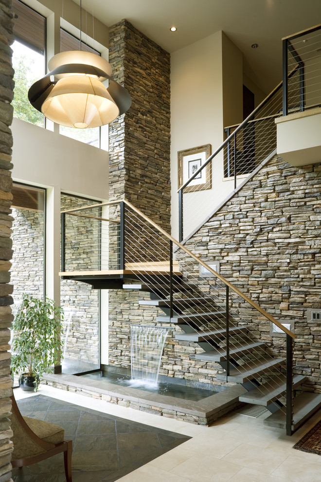 Trendy open and cable railing staircase photo in Portland