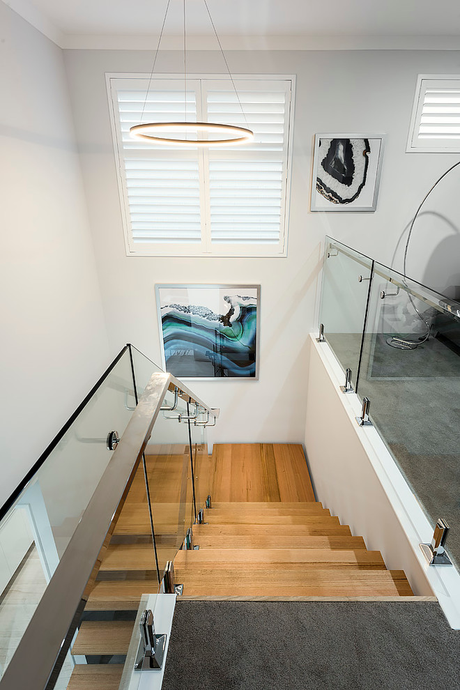 Design ideas for a medium sized contemporary wood floating staircase in Perth with open risers.
