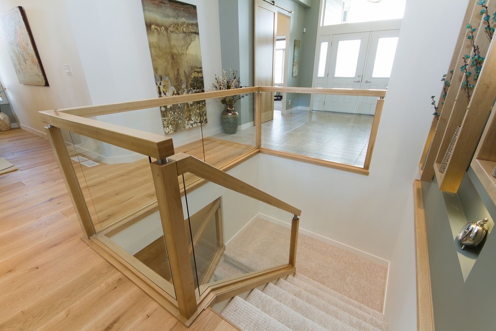 Photo of a large scandi carpeted u-shaped staircase in Other with carpeted risers.