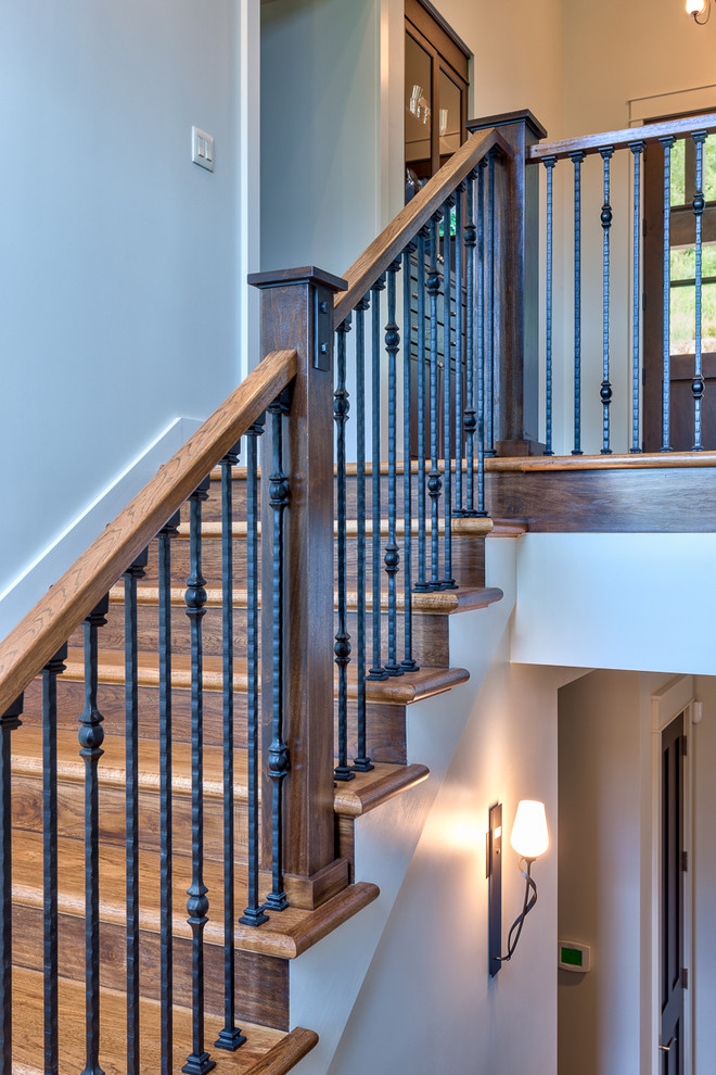 Inspiration for a medium sized classic wood u-shaped mixed railing staircase in Other with wood risers.