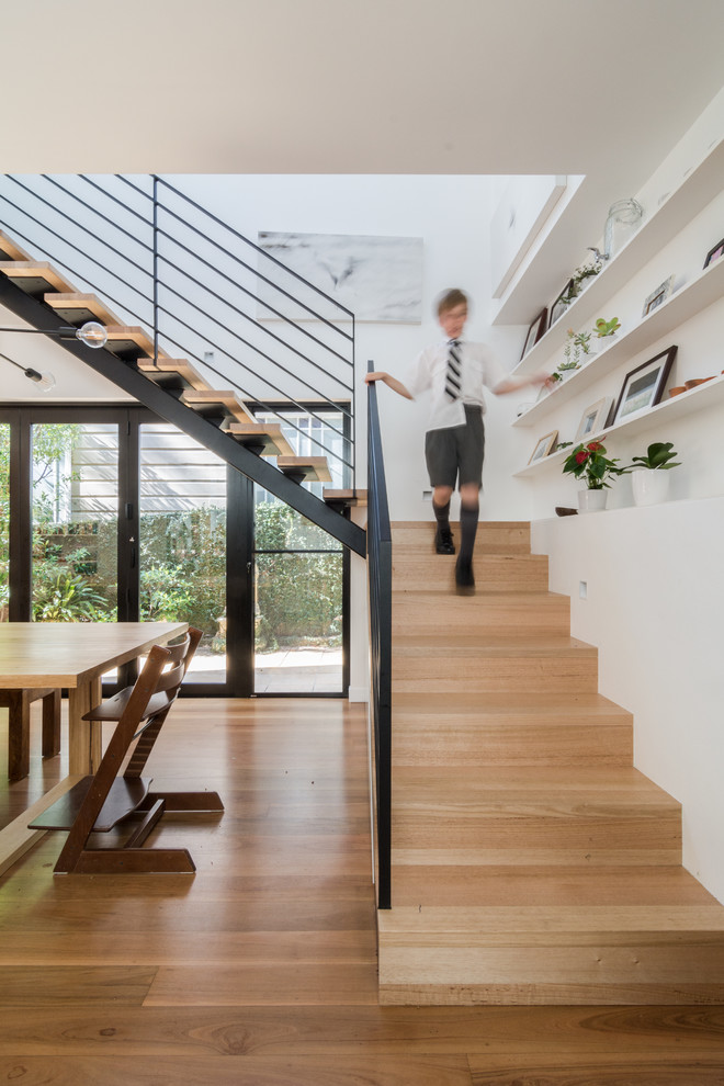 Inspiration for a medium sized contemporary wood l-shaped metal railing staircase in Sydney with open risers.