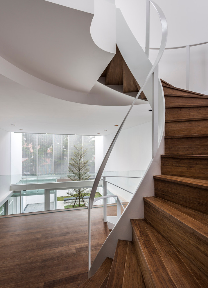 Design ideas for a contemporary staircase in Singapore with feature lighting.