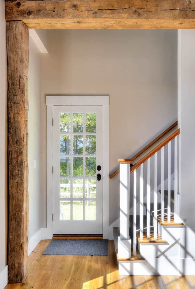 Staircase - mid-sized farmhouse wooden straight staircase idea in New York with painted risers