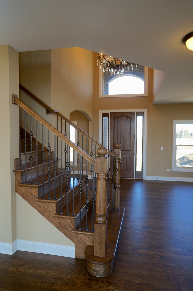 Mid-sized elegant wooden straight staircase photo in Chicago with wooden risers