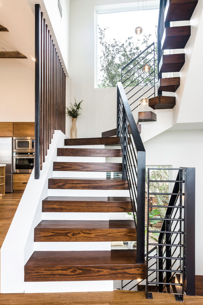 Inspiration for a mid-sized contemporary wooden floating open and metal railing staircase remodel in Los Angeles
