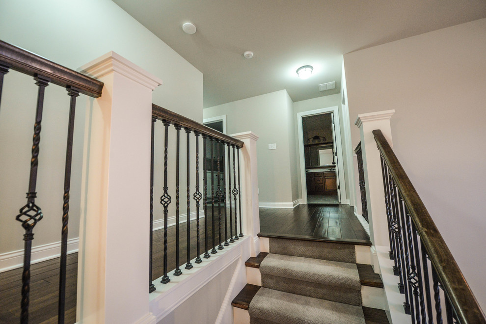 Photo of a traditional staircase in Chicago with feature lighting.