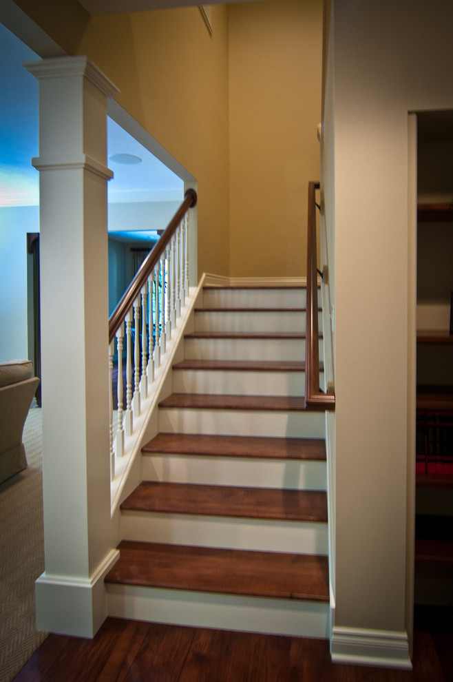 Staircase - traditional wooden staircase idea in Grand Rapids with wooden risers