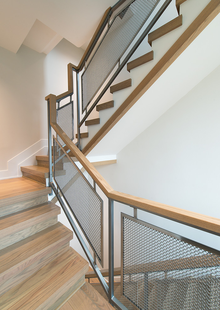 Свежая идея для дизайна: деревянная лестница в скандинавском стиле с деревянными ступенями - отличное фото интерьера