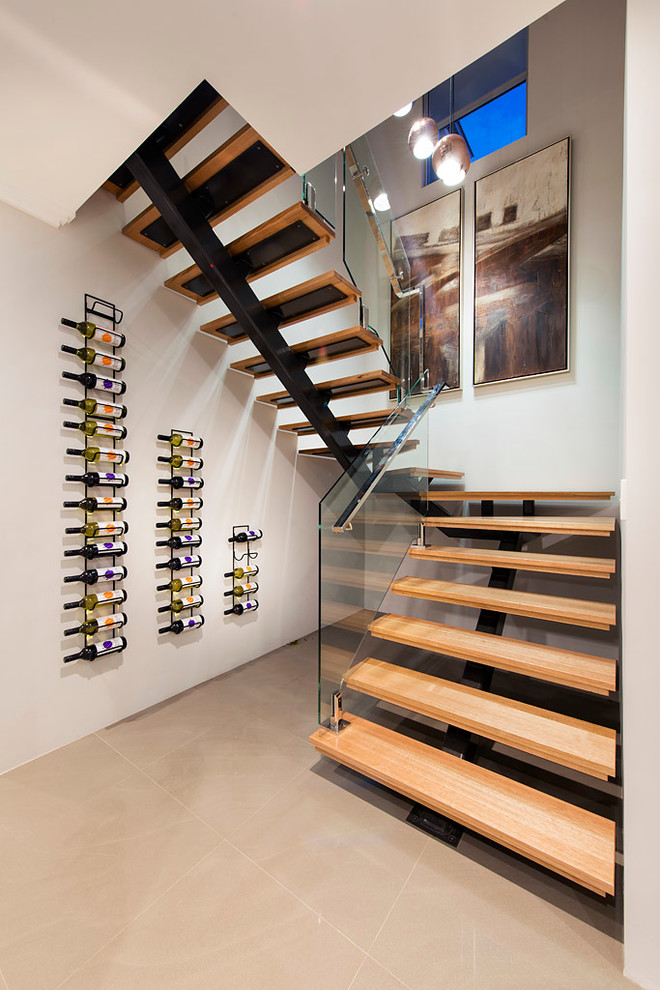 Imagen de escalera en U contemporánea de tamaño medio con escalones de madera