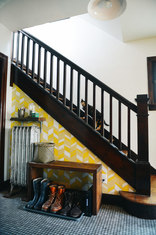 Example of a small arts and crafts wooden straight staircase design in Other