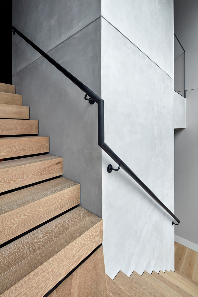 Photo of a contemporary wood l-shaped metal railing staircase in Melbourne with wood risers.
