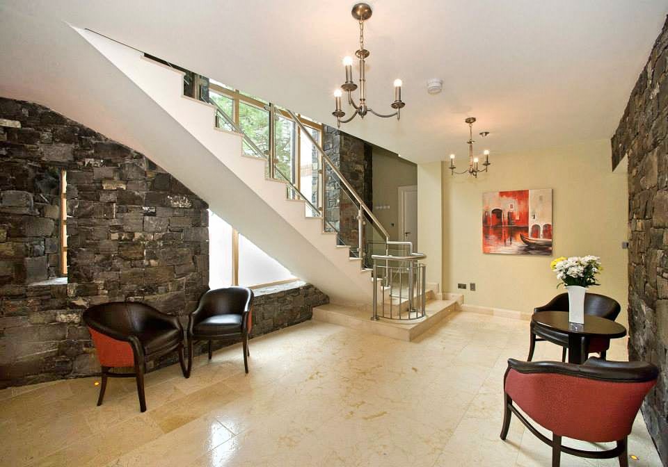 This is an example of a large contemporary floating staircase in Other with marble treads and marble risers.