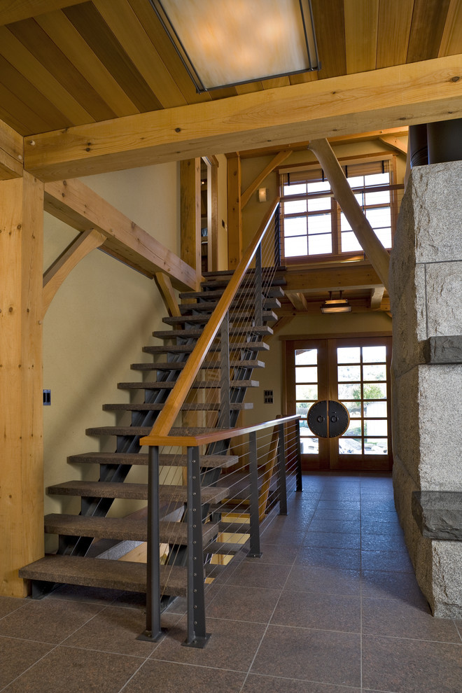 Пример оригинального дизайна: прямая лестница в стиле модернизм с ступенями из сланца и перилами из тросов без подступенок
