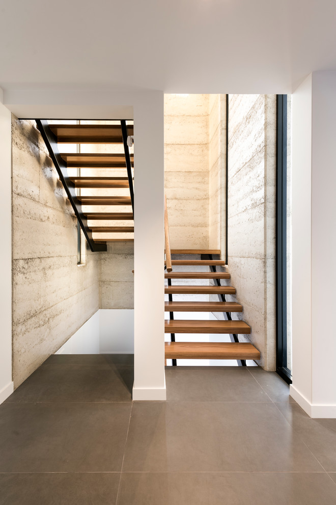 Photo of a contemporary wood u-shaped staircase in Perth with open risers.