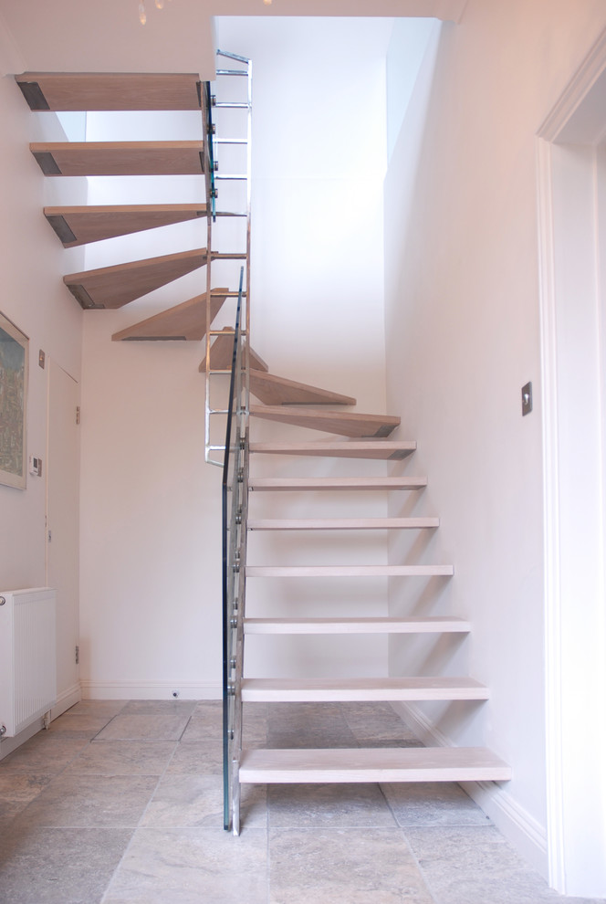 Inspiration for a scandi wood floating staircase in London with open risers.