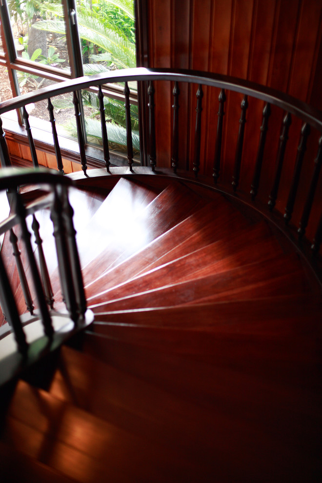 Example of a large classic spiral metal railing staircase design in Brisbane