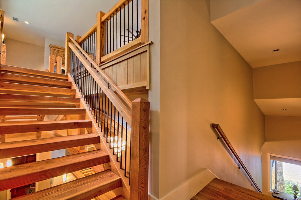 Imagen de escalera en L de estilo americano grande sin contrahuella con escalones de madera
