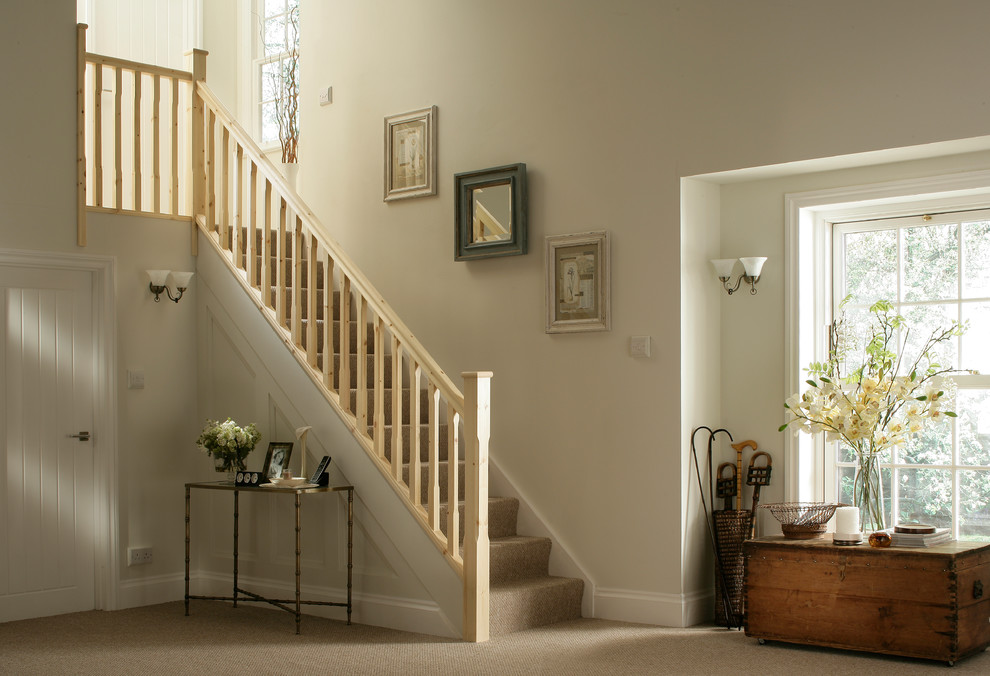 Inspiration for a contemporary carpeted straight wood railing staircase with carpeted risers.