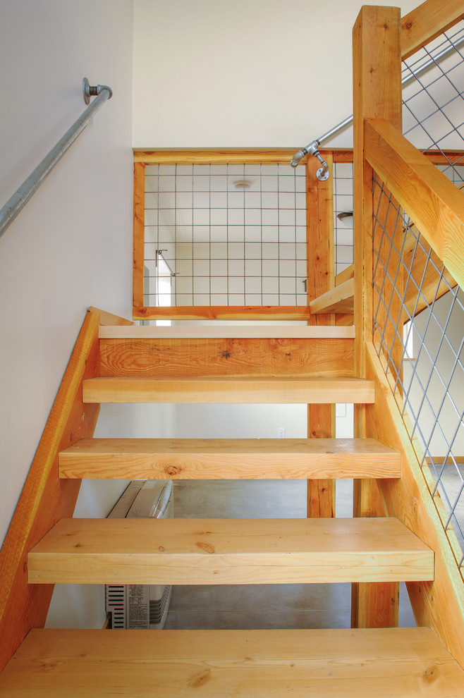 This is an example of a small contemporary wood l-shaped staircase in Other with wood risers.