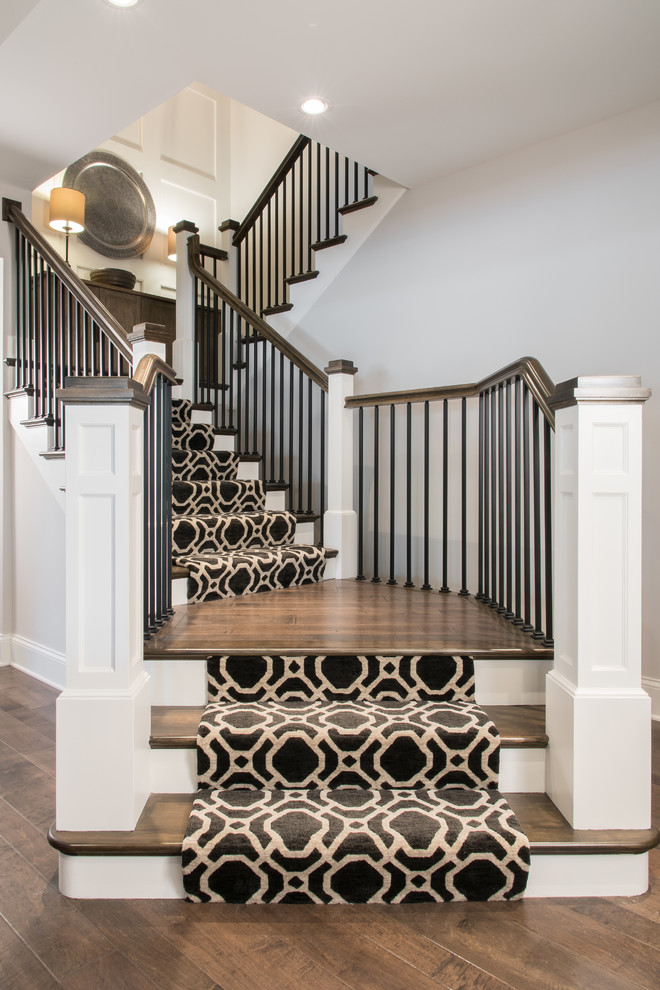 Photo of a large traditional wood wood railing staircase in St Louis.