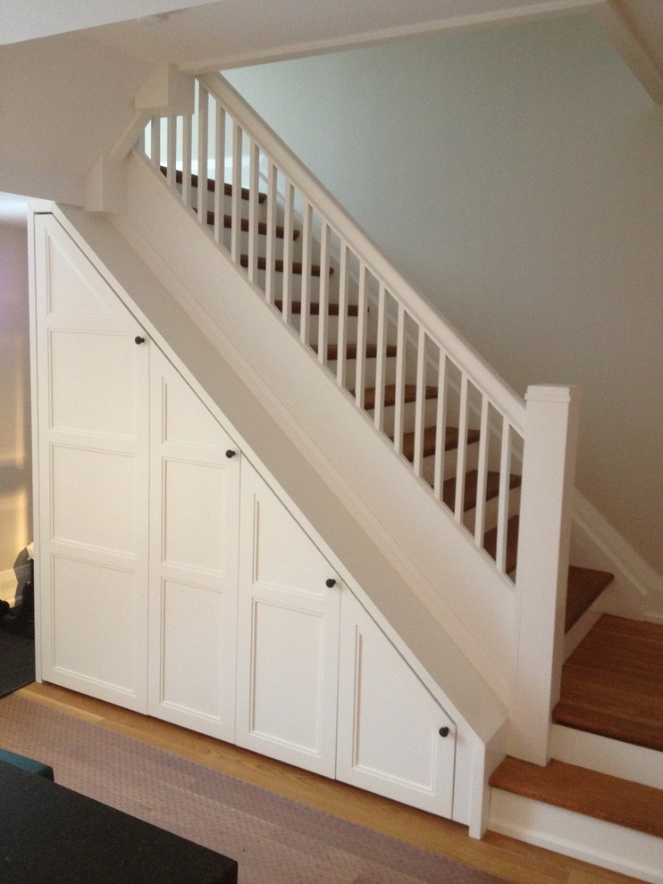Photo of a classic staircase in Toronto with under stair storage.