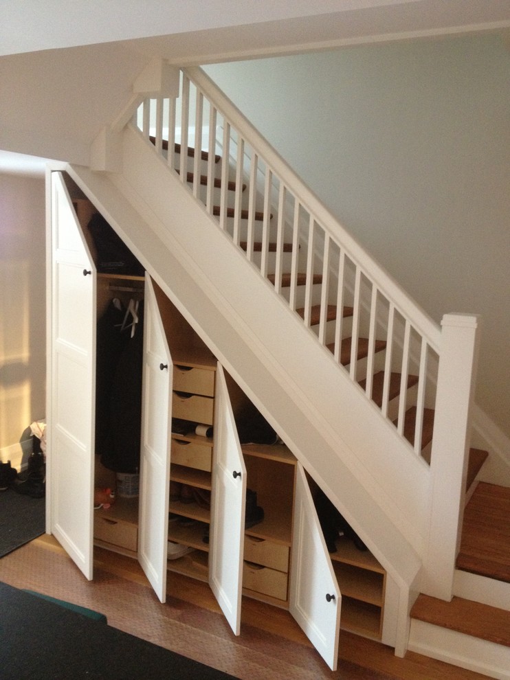 This is an example of a traditional staircase in Toronto with under stair storage.