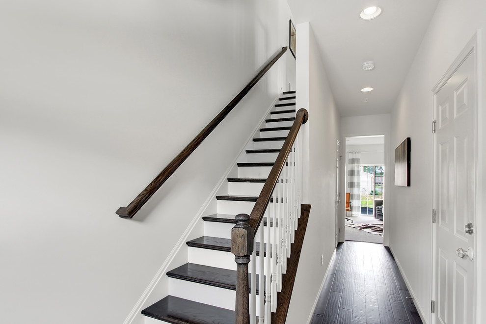 Staircase - mid-sized transitional wooden straight staircase idea in Philadelphia with painted risers