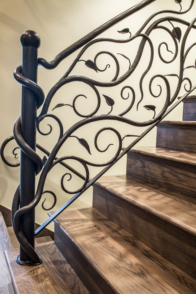 Inspiration for a mid-sized rustic wooden straight staircase remodel in St Louis with wooden risers