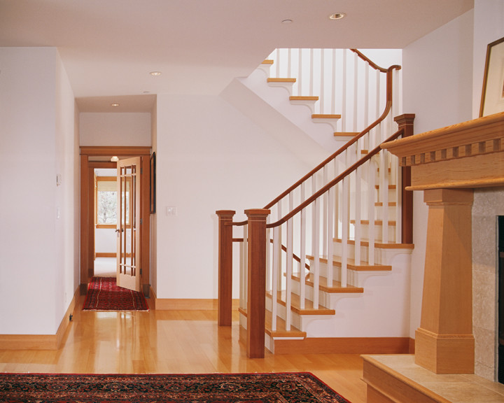 Mid-sized arts and crafts wooden curved wood railing staircase photo in Other with wooden risers