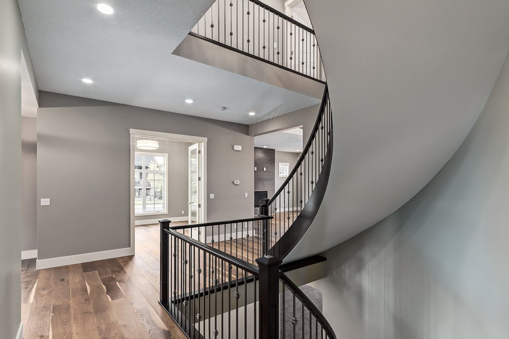 Inspiration for a transitional curved staircase remodel in Calgary