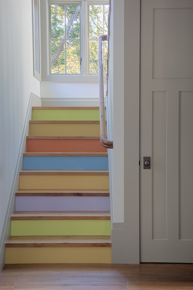Inspiration for an eclectic wooden u-shaped staircase remodel in San Francisco with painted risers