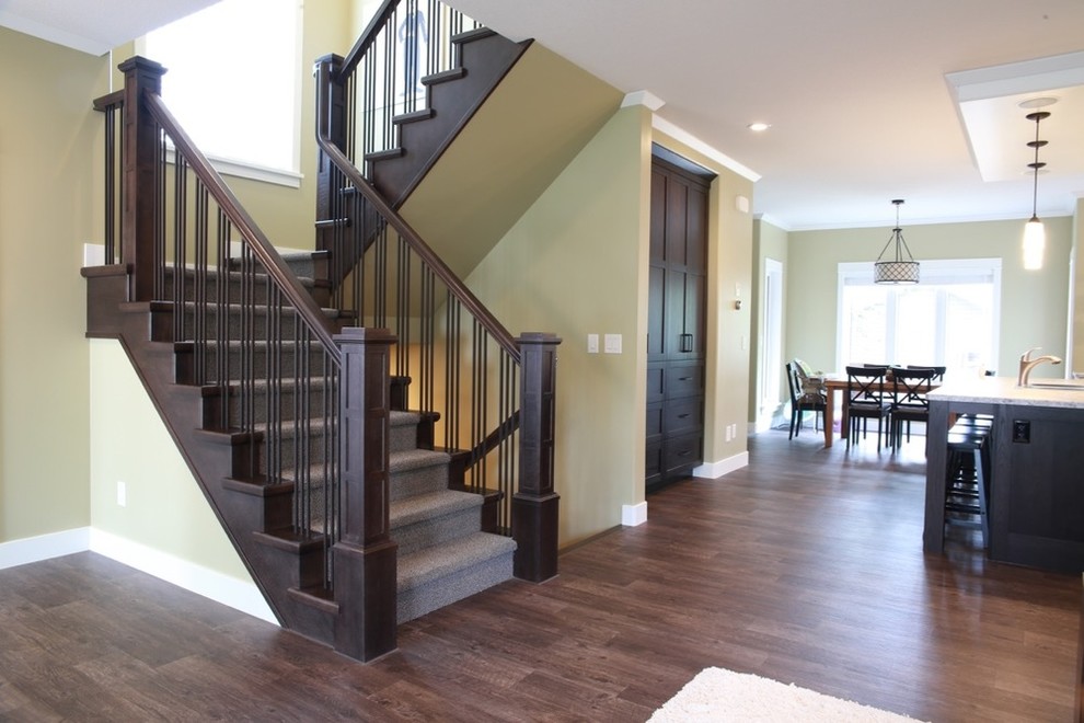 Inspiration for a mid-sized timeless carpeted u-shaped staircase remodel in Other with carpeted risers