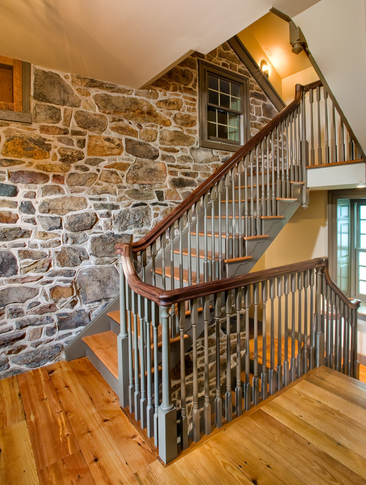 Design ideas for a farmhouse wood u-shaped mixed railing staircase with wood risers.