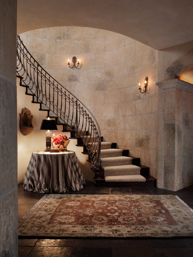Classic curved staircase in San Francisco with feature lighting.