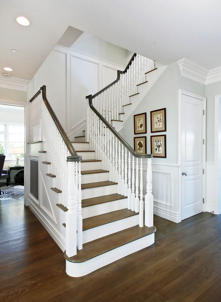 Inspiration for a traditional staircase in Los Angeles with feature lighting.
