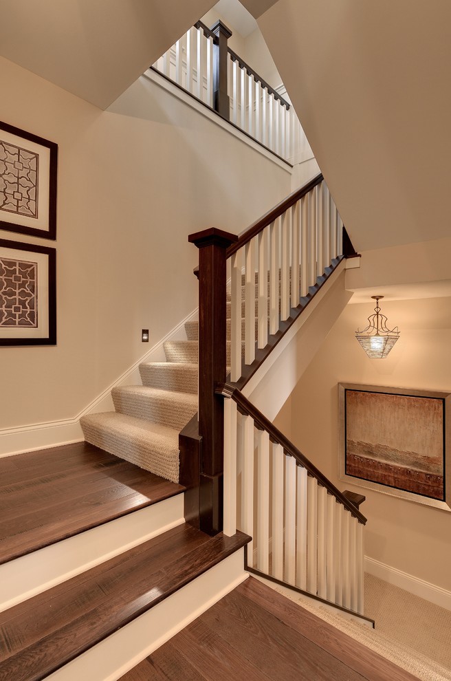 Elegant wooden staircase photo in Minneapolis