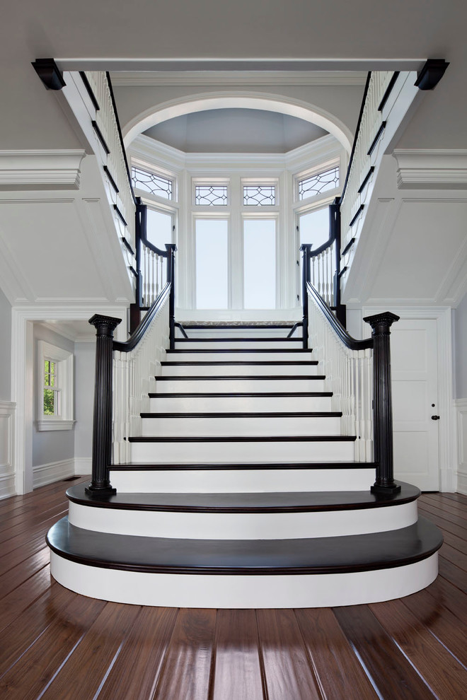 Staircase - traditional wooden staircase idea in New York