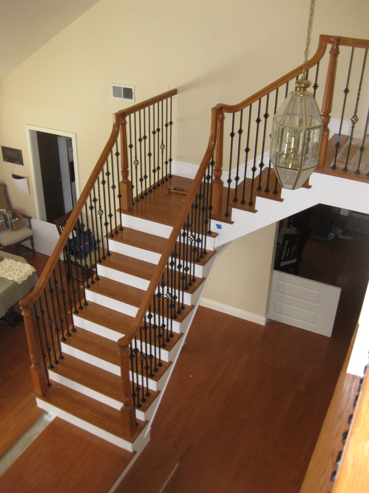 Staircase - mid-sized traditional wooden l-shaped staircase idea in Orange County with painted risers