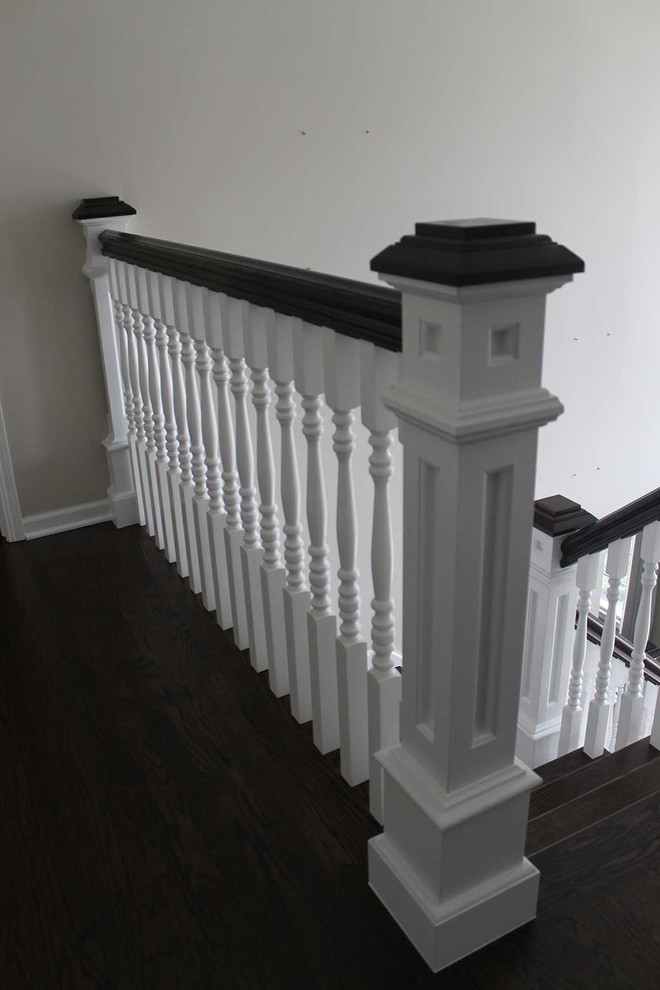 Inspiration for a mid-sized timeless wooden l-shaped staircase remodel in Chicago with painted risers