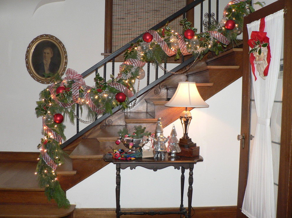 Inspiration for a mid-sized timeless wooden l-shaped staircase remodel in Seattle with wooden risers