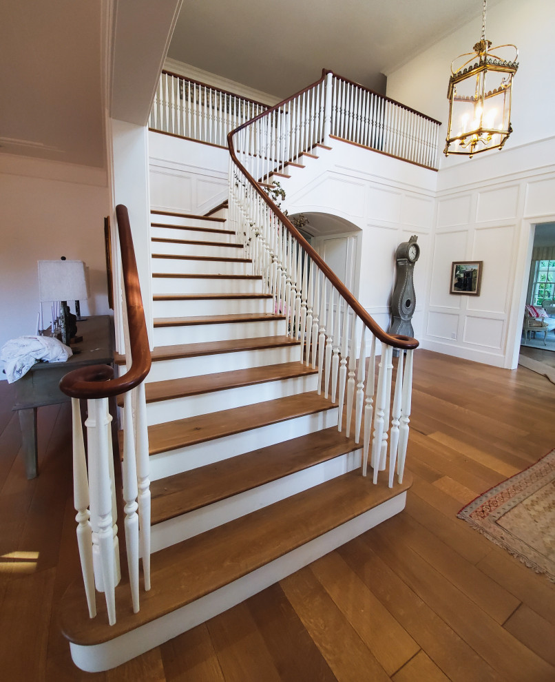 Staircase - large traditional wooden l-shaped wood railing staircase idea in Salt Lake City with wooden risers