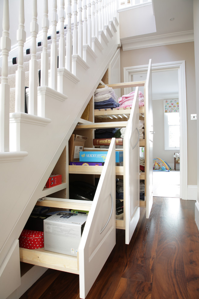 Photo of a traditional staircase in London with under stair storage.