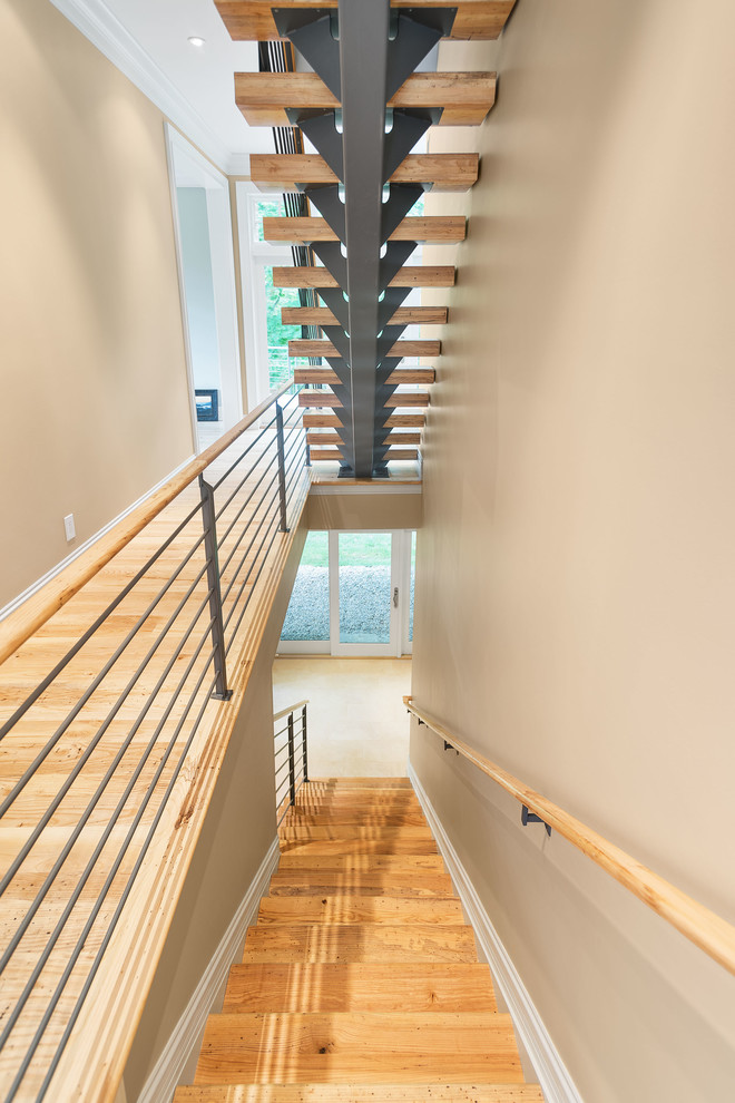 Exemple d'un grand escalier sans contremarche flottant tendance avec des marches en bois.