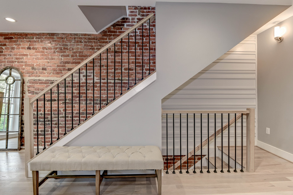 Inspiration for a large transitional wooden straight staircase remodel in DC Metro with painted risers