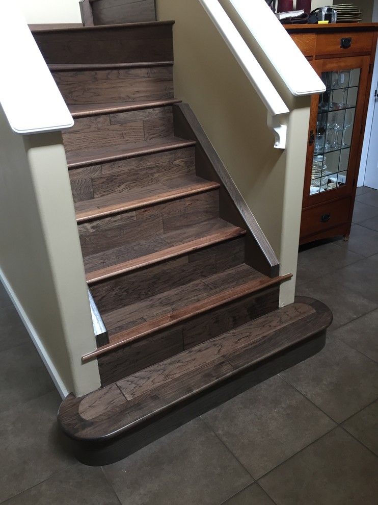 Mid-sized transitional wooden straight staircase photo in Calgary with wooden risers