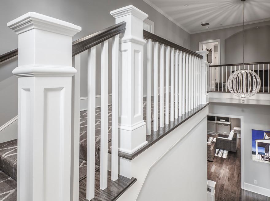 Staircase - mid-sized transitional wooden u-shaped wood railing staircase idea in Seattle with painted risers