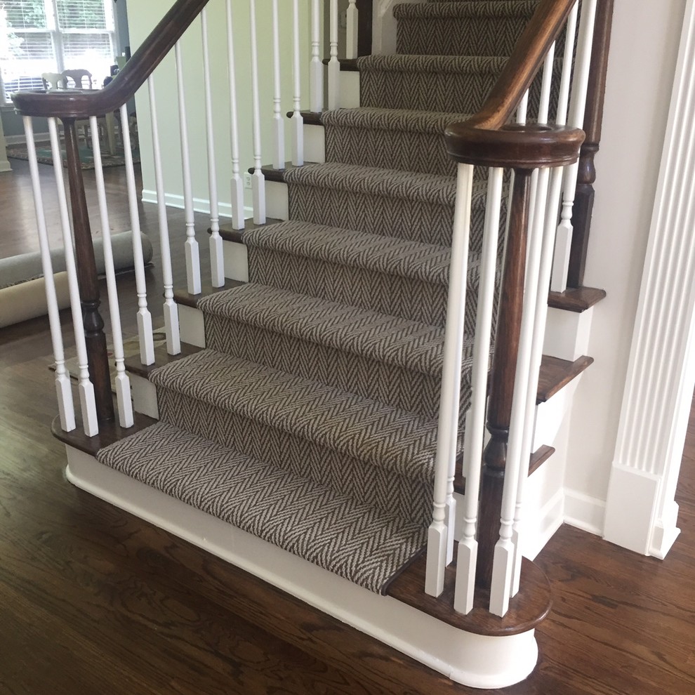 Medium sized traditional wood straight staircase in Charleston with carpeted risers.