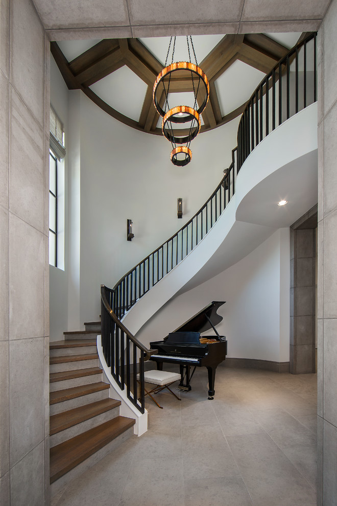 Traditional wood curved staircase in Dallas.