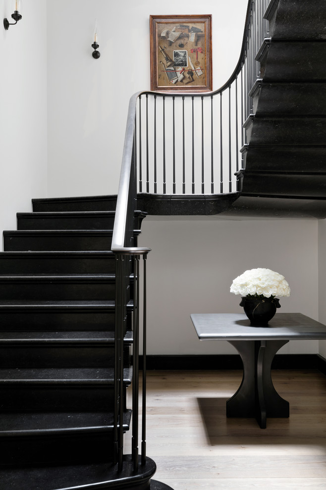 This is an example of a modern curved metal railing staircase in New York.