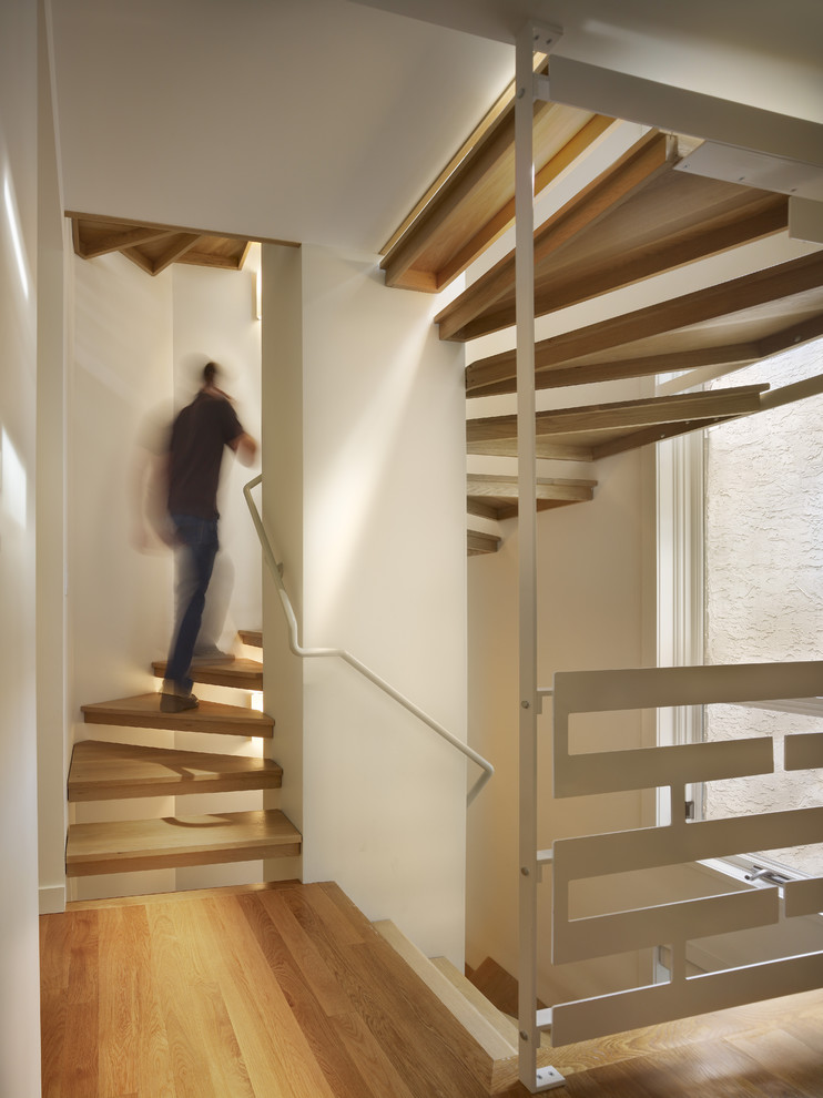 Photo of a contemporary wood staircase in Philadelphia with open risers.